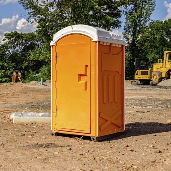 what is the cost difference between standard and deluxe porta potty rentals in Rowena